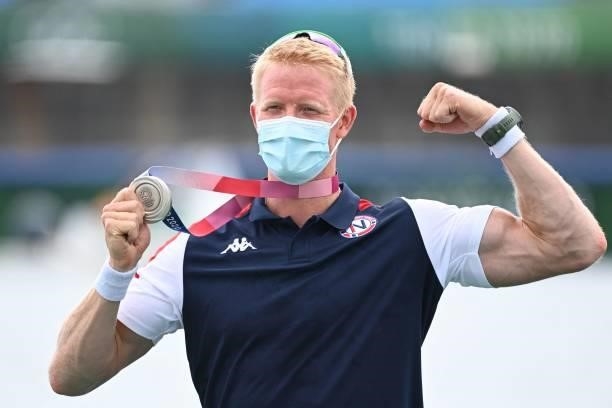 Silver medalist Norway's Kjetil Borch poses on the podium following the men's single sculls final during the Tokyo 2020 Olympic Games at the Sea...