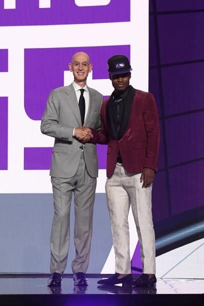 Davion Mitchell shakes hands with NBA Commissioner Adam Silver after being selected number nine overall by the Sacramento Kings during the 2021 NBA...