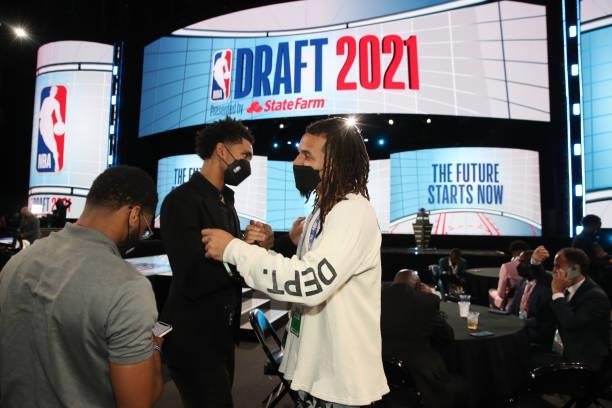 James Bouknight high fives Cole Anthony of the Orlando Magic during the 2021 NBA Draft on July 29, 2021 at the Barclays Center, New York. NOTE TO...