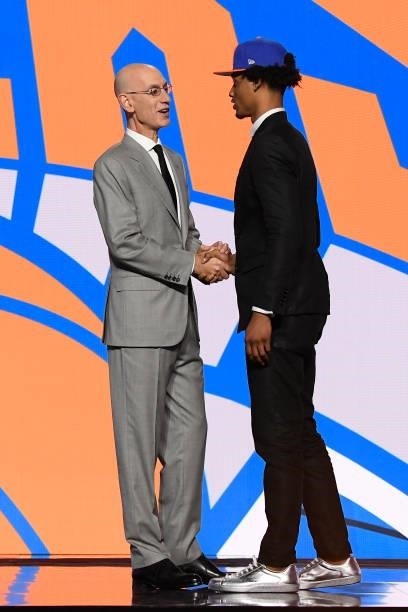Keon Johnson shakes hands with NBA Commissioner Adam Silver after being selected number twenty one overall by the New York Knicks during the 2021 NBA...