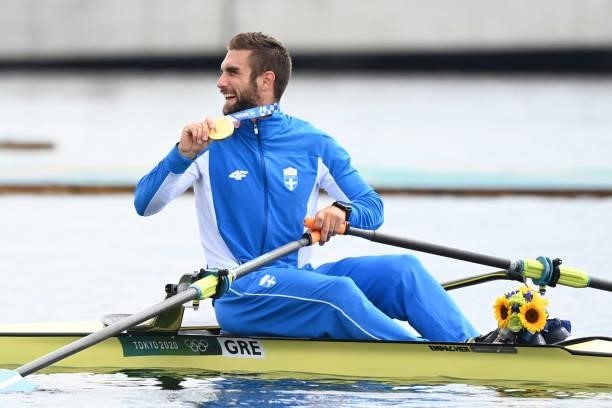 Gold medalist Greece's Stefanos Ntouskos poses in his boat following the men's single sculls final during the Tokyo 2020 Olympic Games at the Sea...
