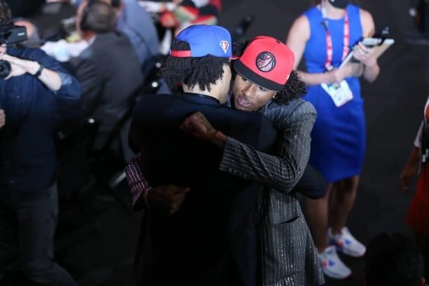 Jalen Green celebrates with Cade Cunningham after being selected during the 2021 NBA Draft on July 29, 2021 at Barclays Center in Brooklyn, New York....