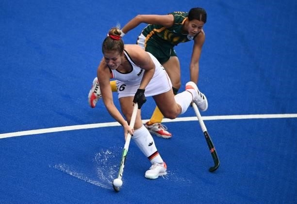 Germany's Sonja Zimmermann dribbles the ball during the women's pool A match of the Tokyo 2020 Olympic Games field hockey competition against South...