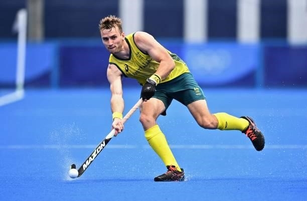 Australia's Joshua Simmonds carries the ball during the men's pool A match of the Tokyo 2020 Olympic Games field hockey competition against Spain, at...