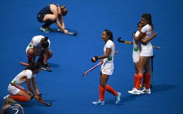 Players of India celebrate after defeating Ireland 1-0 in their women's pool A match of the Tokyo 2020 Olympic Games field hockey competition, at the...