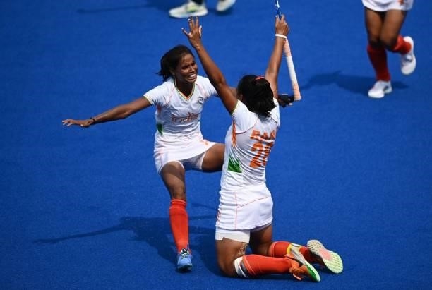 Players of India celebrate after scoring against Ireland during their women's pool A match of the Tokyo 2020 Olympic Games field hockey competition,...