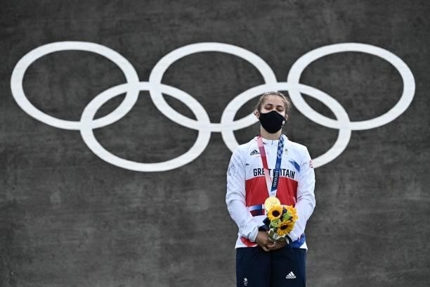 Britain's Bethany Shriever stands on the podium for the victory ceremony for the cycling BMX racing women's event at the Ariake Urban Sports Park...