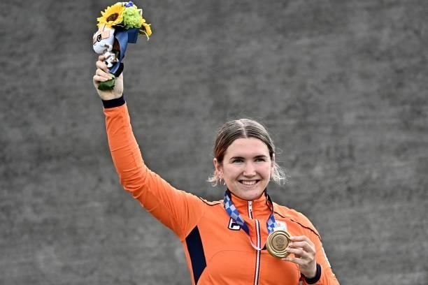 Netherlands' Merel Smulders celebrates on the podium for the victory ceremony for the cycling BMX racing women's event at the Ariake Urban Sports...
