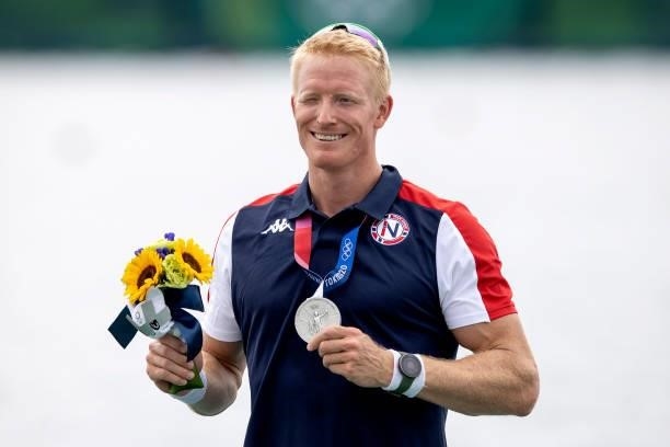 Silver medalist Kjetil Borch of Team Norway pose with his medal during the medal ceremony for the Men's Single Sculls Final A on day seven of the...