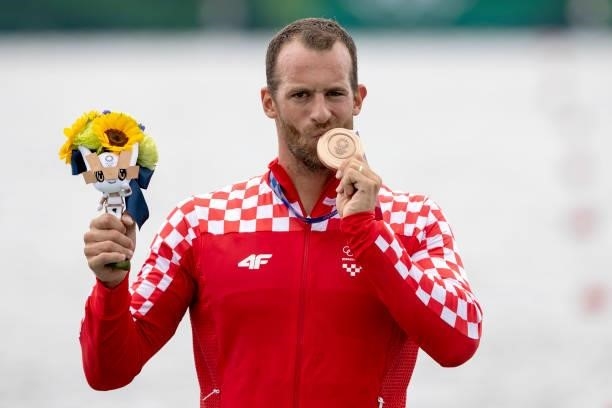 Damir Martin of Team Croatia celebrates winning the bronze medal during the medal ceremony for the Men's Single Sculls Final A on day seven of the...