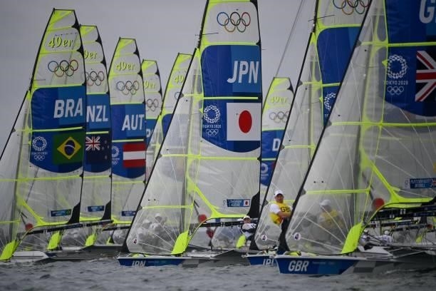 Competitors take part in the men's skiff 49er race during the Tokyo 2020 Olympic Games sailing competition at the Enoshima Yacht Harbour in Fujisawa,...