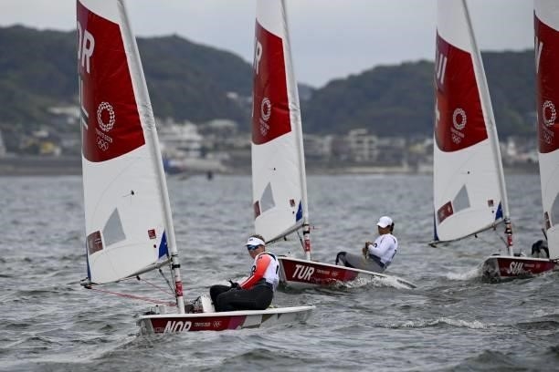 Norway's Line Flem Host competes in the women's one-person dinghy laser radial race during the Tokyo 2020 Olympic Games sailing competition at the...