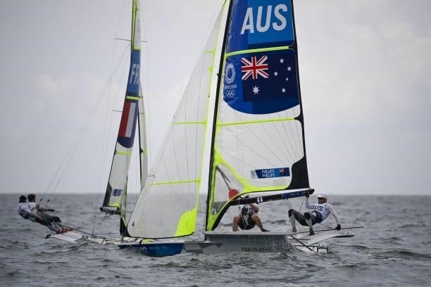 France's Emile Amoros and Lucas Rual and Australia's Sam Phillips and William Phillips compete in the men's skiff 49er race during the Tokyo 2020...