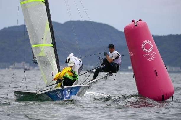 Germany's Thomas Ploessel and Erik Heil compete in the men's skiff 49er race during the Tokyo 2020 Olympic Games sailing competition at the Enoshima...