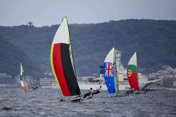 Germany's Thomas Ploessel and Erik Heil compete in the men's skiff 49er race during the Tokyo 2020 Olympic Games sailing competition at the Enoshima...