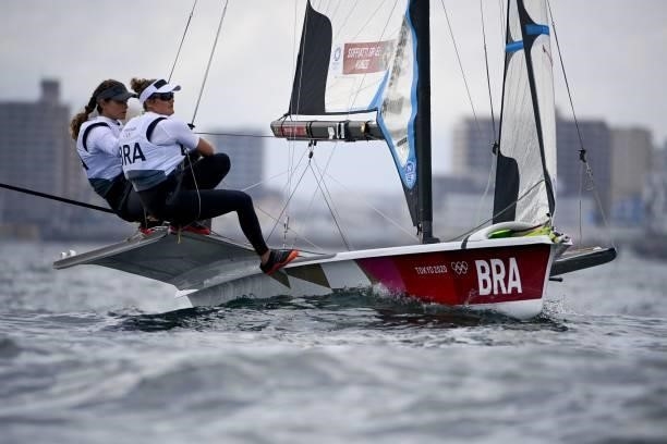 Brazil's Martine Grael and Kahena Kunze compete in the women's skiff 49er FX race during the Tokyo 2020 Olympic Games sailing competition at the...