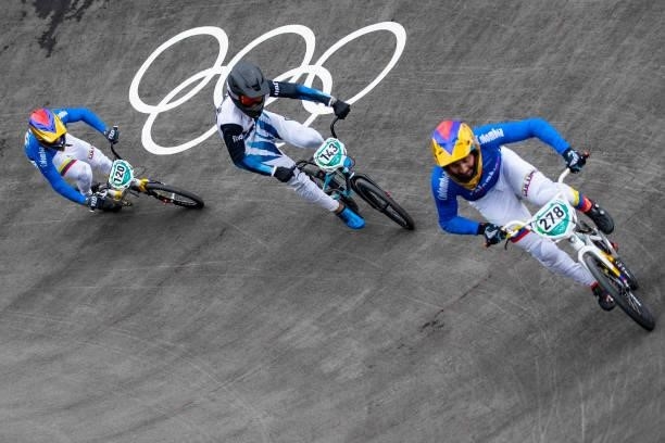 Vincent Pelluard of Columbia, Nicolas Torres of Argentina and Carlos Alberto Ramirez Yepes of Columbia compete during the Men's BMX Racing Run on day...