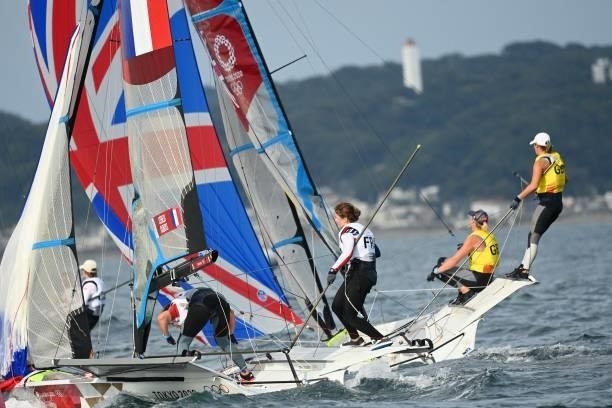 Britains Charlotte Dobson and Saskia Tidey compete in the women's skiff 49er FX race during the Tokyo 2020 Olympic Games sailing competition at the...