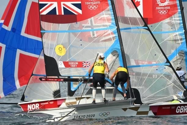 Britains Charlotte Dobson and Saskia Tidey compete in the women's skiff 49er FX race during the Tokyo 2020 Olympic Games sailing competition at the...