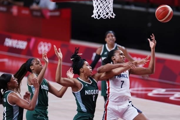 France's Sandrine Gruda fights for a rebouid with Nigeria's Pallas Kunaiyi-Akpanah in the women's preliminary round group B basketball match between...