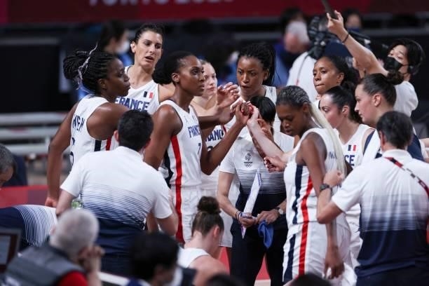 France's Sandrine Gruda join hands with teammates during a time out in the women's preliminary round group B basketball match between France and...