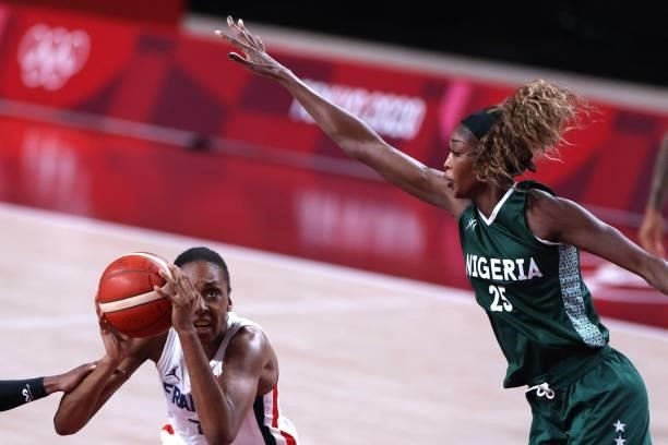 France's Sandrine Gruda goes to the basket past Nigeria's Victoria Macaulay in the women's preliminary round group B basketball match between France...