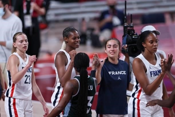Nigeria's Ezinne Kalu congratulates French players after France's victory in the women's preliminary round group B basketball match between France...