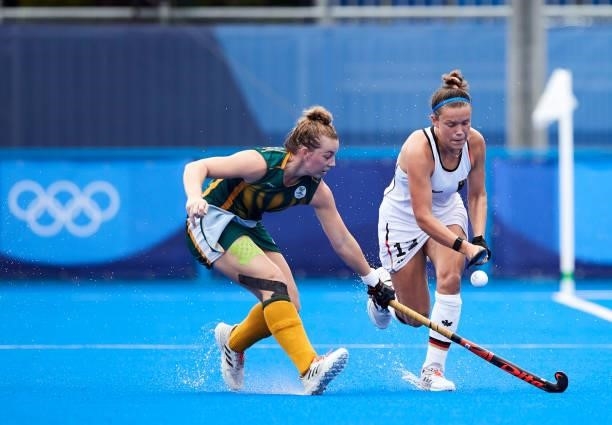 Charlotte Stapenhorst of Germany battle for the ball during the Women's Pool A - Hockey Match between South Africa and Germany on day seven of the...