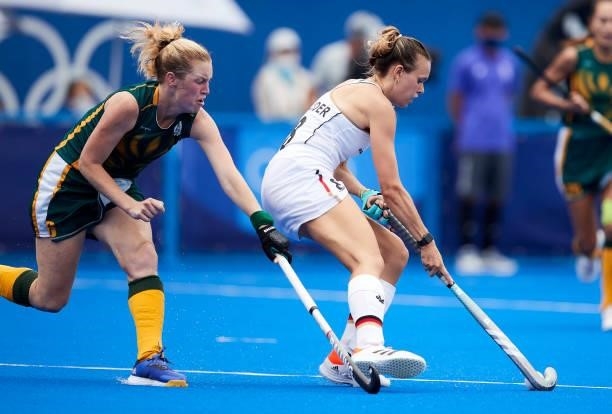 Anne Katarina Schroder of Germany battle for the ball during the Women's Pool A - Hockey Match between South Africa and Germany on day seven of the...