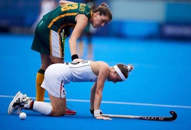 Charlotte Stapenhorst of Germany lies injured on the pitch during the Women's Pool A - Hockey Match between South Africa and Germany on day seven of...