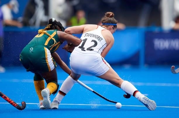 Charlotte Stapenhorst of Germany battle for the ball during the Women's Pool A - Hockey Match between South Africa and Germany on day seven of the...