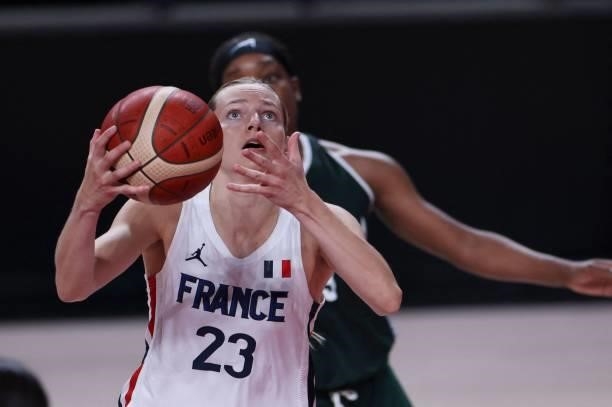 France's Marine Johannes goes to the basket in the women's preliminary round group B basketball match between France and Nigeria during the Tokyo...