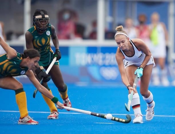 Kira Horn of Germany battle for the ball during the Women's Pool A - Hockey Match between South Africa and Germany on day seven of the Tokyo 2020...