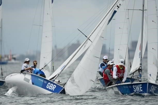 Competitors take part in the women's two-person dinghy 470 race during the Tokyo 2020 Olympic Games sailing competition at the Enoshima Yacht Harbour...