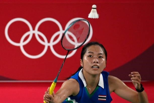 Thailand's Ratchanok Intanon hits a shot to Taiwan's Tai Tzu-ying in their women's singles badminton quarter final match during the Tokyo 2020...