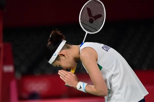 Taiwan's Tai Tzu-ying celebrates after beating Thailand's Ratchanok Intanon in their women's singles badminton quarter final match during the Tokyo...