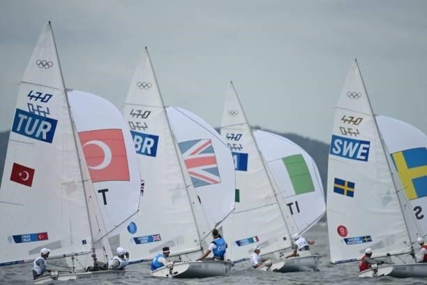 Competitors take part in the men's two-person dinghy 470 race during the Tokyo 2020 Olympic Games sailing competition at the Enoshima Yacht Harbour...
