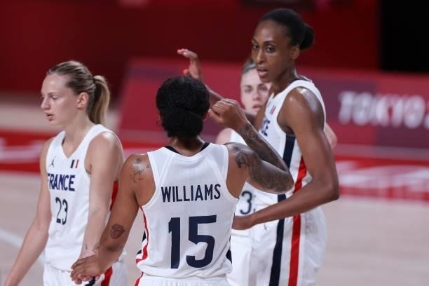French players celebrate their victory at the end of the women's preliminary round group B basketball match between France and Nigeria during the...