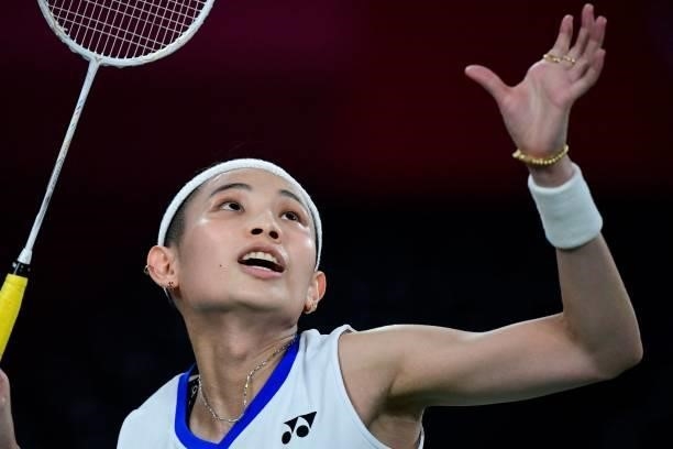 Taiwan's Tai Tzu-ying prepares to hit a shot to Thailand's Ratchanok Intanon in their women's singles badminton quarter final match during the Tokyo...