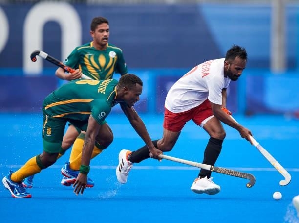 Keegan Pereira of Canada battle for the ball during the Men's Pool B - Hockey Match between Canada and South Africa on day seven of the Tokyo 2020...
