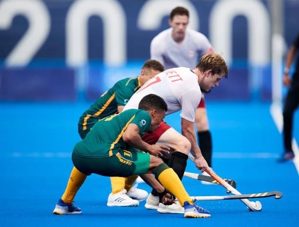 Brenden Bisset of Canada battle for the ball during the Men's Pool B - Hockey Match between Canada and South Africa on day seven of the Tokyo 2020...
