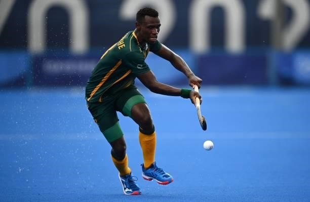 South Africa's Nduduza Peabo Lembethe controls the ball during the men's pool B match of the Tokyo 2020 Olympic Games field hockey competition...