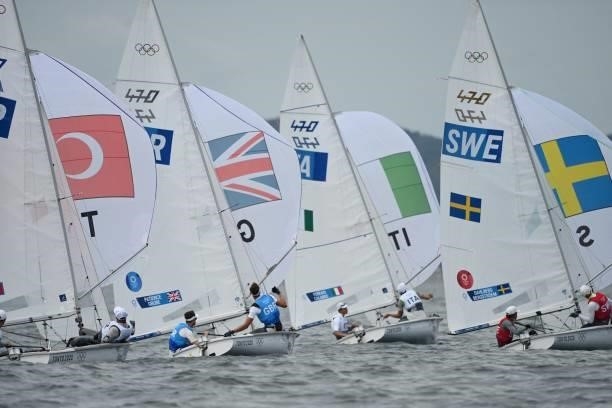 Competitors take part in the men's two-person dinghy 470 race during the Tokyo 2020 Olympic Games sailing competition at the Enoshima Yacht Harbour...