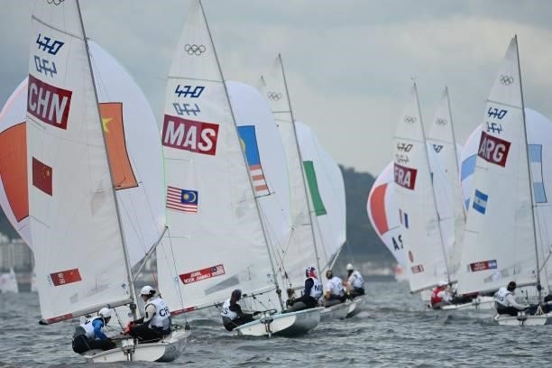 Competitors take part in the women's two-person dinghy 470 race during the Tokyo 2020 Olympic Games sailing competition at the Enoshima Yacht Harbour...