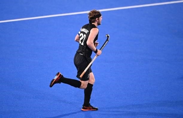 New Zealand's Blair Tarrant runs during the men's pool A match of the Tokyo 2020 Olympic Games field hockey competition against Argentina, at the Oi...