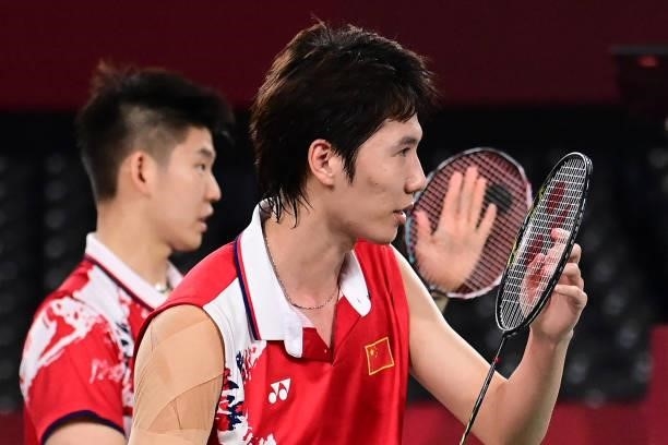 China's Li Junhui and China's Liu Yuchen celebrate after winning their men's doubles badminton semi-final match against Malaysia's Soh Wooi Yik and...