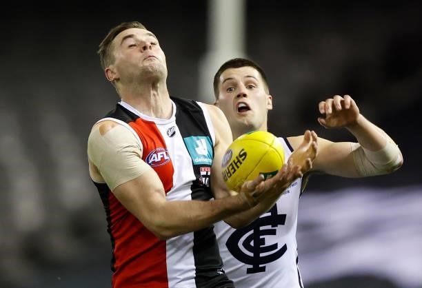 Brad Crouch of the Saints and Nic Newman of the Blues in action during the 2021 AFL Round 20 match between the St Kilda Saints and the Carlton Blues...