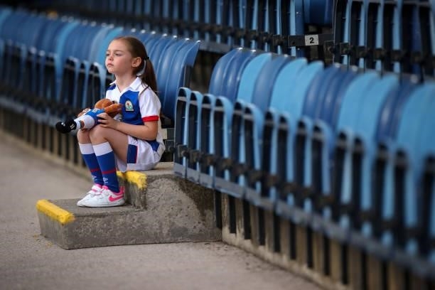 Young female fan holds a Blackburn Rovers mascot, Roar the Lion teddy during the Pre-Season Friendly match between Blackburn Rovers and Leeds United...