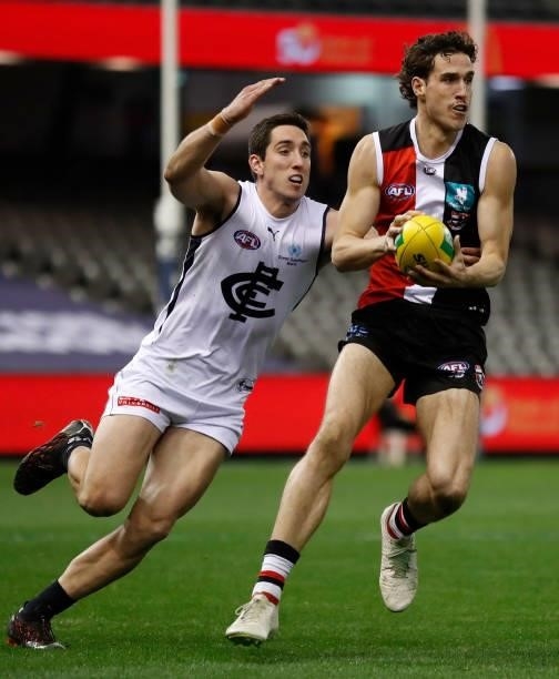Max King of the Saints is tackled by Jacob Weitering of the Blues during the 2021 AFL Round 20 match between the St Kilda Saints and the Carlton...