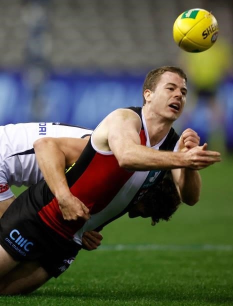 Jack Higgins of the Saints handpasses the ball during the 2021 AFL Round 20 match between the St Kilda Saints and the Carlton Blues at Marvel Stadium...